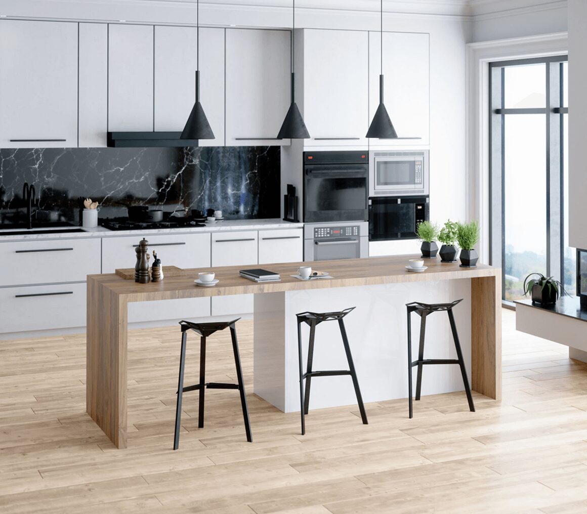 Modern kitchen with wooden island and black stools under pendant lights.